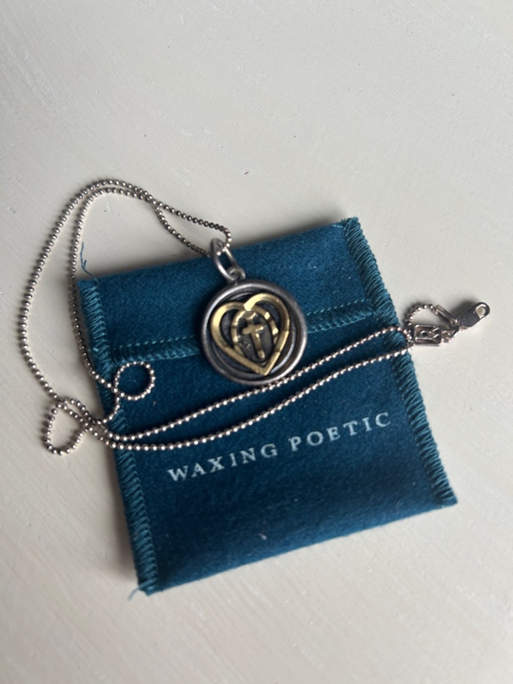 Waxing Poetic Two-Tone Heart Medallion Necklace in Gold & Silver